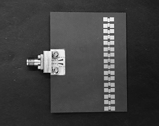 How does the performance of slotted waveguide array antennas affect their application in radar systems?