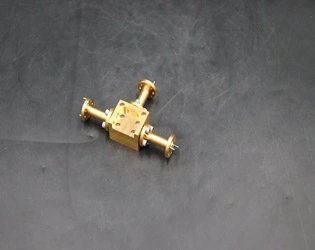 How to improve isolation between ports of a waveguide power divider?